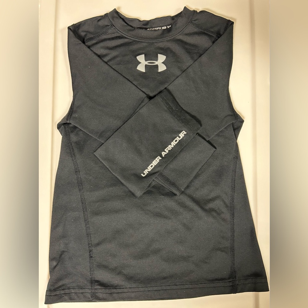Boy’s black Under Armour shirt.